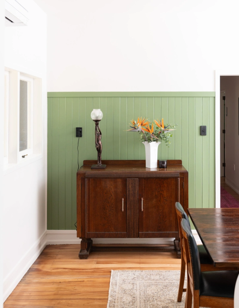 Dining room featuring Aalto Mulberry Bush walls and restored Art Deco details
