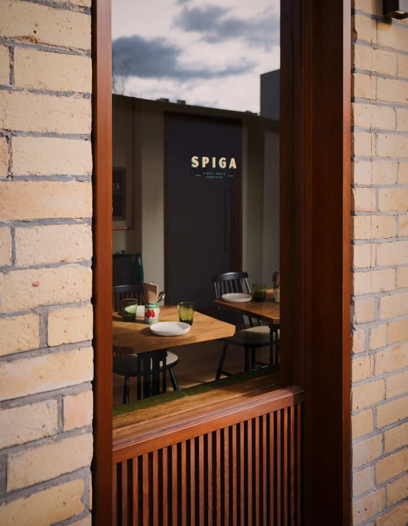 Exterior of Spiga restaurant in Remuera with warm timber entrance and inviting street frontage